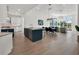 Bright, airy open-concept living space with modern kitchen, dining area, and living room at 10148 Chiltern Garden Dr, Orlando, FL 32827