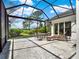 Spacious screened patio offers views of the landscaped backyard, lounge chairs, and outdoor dining at 10148 Chiltern Garden Dr, Orlando, FL 32827