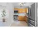 Cozy kitchen with stainless steel appliances, wood cabinets, and tiled flooring at 1018 Wentrop Ln, Orlando, FL 32804