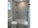 Bathroom features a large tiled shower with a window and black fixtures at 1055 W French Ave, Orange City, FL 32763