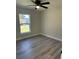 Bedroom featuring a ceiling fan and natural light from a side window at 1055 W French Ave, Orange City, FL 32763