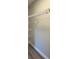 Bright walk-in closet with metal shelving and gray flooring at 1055 W French Ave, Orange City, FL 32763