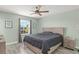 Comfortable bedroom featuring a ceiling fan, a neutral color palette, and ample natural light at 11844 Pulitzer Pl, Orlando, FL 32832