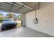 Spacious two-car garage featuring an electric vehicle charging outlet and access to the driveway at 11844 Pulitzer Pl, Orlando, FL 32832
