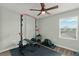 Dedicated home gym equipped with weightlifting equipment, perfect for fitness enthusiasts at 11844 Pulitzer Pl, Orlando, FL 32832