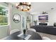 Beautifully staged room with an open layout, connecting the dining and living spaces at 11844 Pulitzer Pl, Orlando, FL 32832