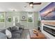 Inviting living room area with lots of light, a fireplace, and modern decor at 11844 Pulitzer Pl, Orlando, FL 32832