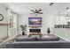 Open-concept living space with a modern fireplace, stylish decor, and neutral color palette at 11844 Pulitzer Pl, Orlando, FL 32832