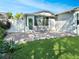 Private fenced backyard featuring a brick patio and lush green lawn at 120 Mayfair Ct # 120, Sanford, FL 32771