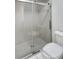Close up of the glass enclosed shower and toilet at 120 Mayfair Ct # 120, Sanford, FL 32771