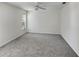 Spacious bedroom with neutral carpet, ceiling fan, and natural light from the window at 120 Mayfair Ct # 120, Sanford, FL 32771