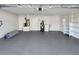 Spacious garage with storage shelves, a water heater, and utility sink for convenience at 120 Mayfair Ct # 120, Sanford, FL 32771