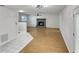 Spacious open concept living space featuring wood-look floors, and a smooth transition to tiled floor at 120 Mayfair Ct # 120, Sanford, FL 32771