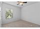 Comfortable bedroom with a window bringing in natural light at 1380 Normandy Heights Cir, Winter Haven, FL 33880