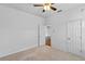 Neutral bedroom featuring a ceiling fan and access to another room at 1380 Normandy Heights Cir, Winter Haven, FL 33880