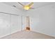 Comfortable bedroom with closet space and ceiling fan at 1380 Normandy Heights Cir, Winter Haven, FL 33880
