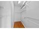 Walk-in closet with wooden floor and wire shelving at 1380 Normandy Heights Cir, Winter Haven, FL 33880