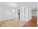 A quaint dining area that features an adjacent galley kitchen and lovely chandelier lighting at 1380 Normandy Heights Cir, Winter Haven, FL 33880