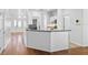 Modern eat-in kitchen features a breakfast bar and views of the living areas at 1380 Normandy Heights Cir, Winter Haven, FL 33880