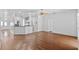 Open-concept living room boasts hardwood floors, recessed lighting, and a modern kitchen at 1380 Normandy Heights Cir, Winter Haven, FL 33880