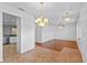 Open living space showcasing tile and hardwood flooring, plus modern lighting at 1380 Normandy Heights Cir, Winter Haven, FL 33880