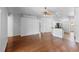 Spacious living area featuring hardwood floors and a ceiling fan at 1380 Normandy Heights Cir, Winter Haven, FL 33880