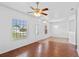 Bright living room with hardwood floors, natural light, and hanging lights at 1380 Normandy Heights Cir, Winter Haven, FL 33880