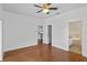 Main bedroom with hardwood floors and access to bathroom and kitchen at 1380 Normandy Heights Cir, Winter Haven, FL 33880