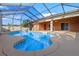 Enjoy the sparkling blue pool, surrounded by a screened enclosure and ample deck space at 1380 Normandy Heights Cir, Winter Haven, FL 33880