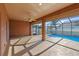 A screened-in lanai with ceiling fan overlooks the sparkling pool in this outdoor oasis at 1380 Normandy Heights Cir, Winter Haven, FL 33880