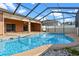 Inviting pool and patio area perfect for outdoor entertaining and relaxation at 1380 Normandy Heights Cir, Winter Haven, FL 33880