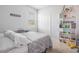 Fun bedroom with quirky shelves, a single bed and a window letting in natural light at 1399 Lassen St, Haines City, FL 33844