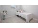 Compact bedroom featuring a single bed with fresh linens and neutral decor at 1399 Lassen St, Haines City, FL 33844