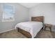 Cozy bedroom featuring neutral walls, a single bed, and a small bedside table by the window at 1399 Lassen St, Haines City, FL 33844