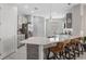 Bright kitchen showcasing a spacious island with bar seating, modern countertops and stainless appliances at 1399 Lassen St, Haines City, FL 33844