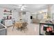 Kitchen with dining space flowing into the living area, offering open-concept living and convenience at 1401 E Voorhis Ave, Deland, FL 32724