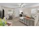 Bright living room with a ceiling fan, comfortable seating and plenty of natural light at 1401 E Voorhis Ave, Deland, FL 32724