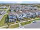 An aerial view of a residential neighborhood featuring similar-style homes, lawns, and driveways at 14317 Lanikai Beach Dr, Orlando, FL 32827