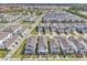 An aerial view of a new home community with neatly arranged homes and street layout at 14317 Lanikai Beach Dr, Orlando, FL 32827