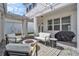 An outdoor living area with a firepit, string lights, and comfortable seating at 14317 Lanikai Beach Dr, Orlando, FL 32827