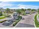 View of a beautiful gated community entrance with lush landscaping and water feature at 14317 Lanikai Beach Dr, Orlando, FL 32827