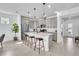 Modern kitchen featuring a large island, stainless steel appliances, and sleek gray cabinetry at 14317 Lanikai Beach Dr, Orlando, FL 32827
