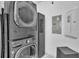 Laundry room with stacked washer and dryer units at 14317 Lanikai Beach Dr, Orlando, FL 32827