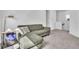 Comfortable living room with green sofa and stylish decor at 14317 Lanikai Beach Dr, Orlando, FL 32827