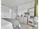 Comfortable main bedroom boasts a large mirror and neutral decor at 14317 Lanikai Beach Dr, Orlando, FL 32827