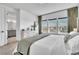 Bright main bedroom featuring large windows and ensuite bathroom at 14317 Lanikai Beach Dr, Orlando, FL 32827