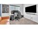 Modern office with a large window, gaming computer, and large flatscreen TV at 14317 Lanikai Beach Dr, Orlando, FL 32827