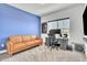 Vibrant office space with a comfortable leather sofa and plenty of natural light at 14317 Lanikai Beach Dr, Orlando, FL 32827