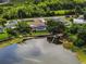 Aerial shot showcasing property with backyard, pool, lake, and boat dock at 1484 Patricia St, Kissimmee, FL 34744