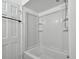 All-white bathroom features a tub-shower combination at 1484 Patricia St, Kissimmee, FL 34744